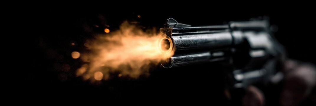 Gun firing pistol - barrel of gun with gunpowder sparked to create explosion and propel munition