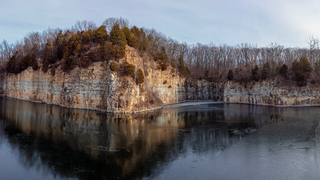 Winter landscape of a water filled abandoned quarry near the Katy Trail State Park in St. Charles County Missouri