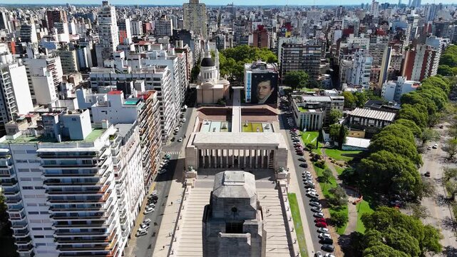 Drone flying away from national flag memorial in rosario, argentina