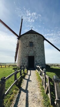 Exploring a historic windmill in normandy with stunning view