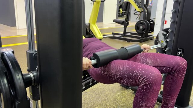 April 30, 2026, Russia, Izhevsk, "Fitness House" center. Elderly woman exercising with gym equipment while focusing on fitness  