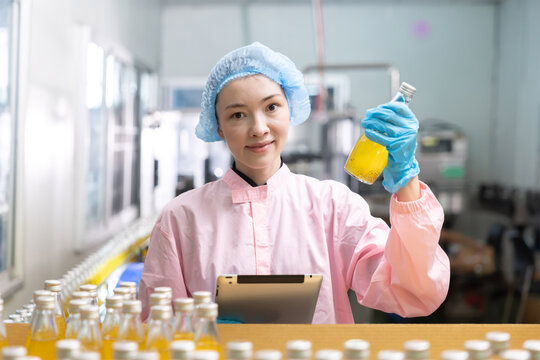 Workers for juice production process at a factory