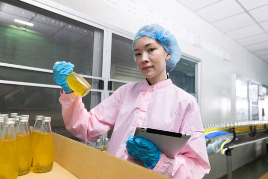 Workers for juice production process at a factory
