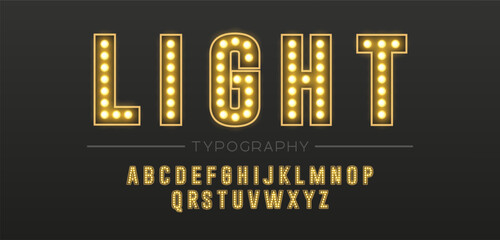 Retro glowing gold typography alphabet  with light bulbs for signage and entertainment design with bold illuminated typography © Angela Ksen