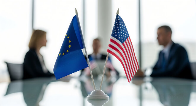European union and united states flags sitting on a glass desk representing diplomatic cooperation and strategic trade partnerships between these two major global economic powers