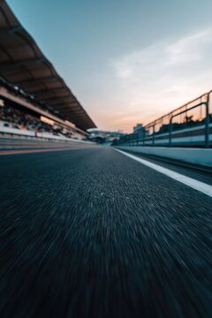 Race track angled perspective along pit lane and grandstand