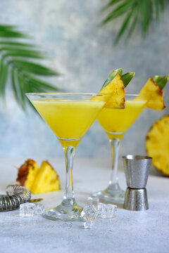 Pineapple cosmopolitan cocktail in a glasses.