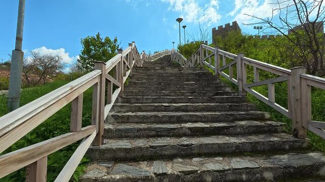 Stone steps climb toward ancient castle walls.  Ram Fortress, Serbia