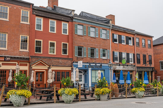 Newburyport, MA, US - September 13, 2022: Street scene in downtown of this small town with its quaint streets with 19th century brick buildings and trendy shops and restaurants.