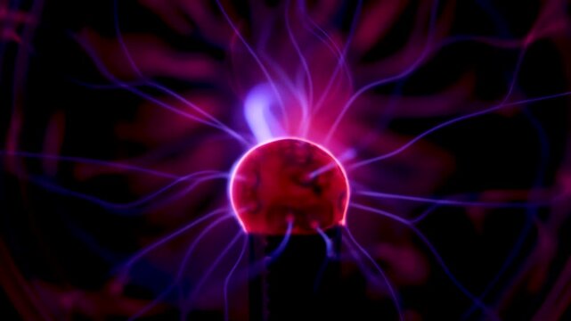 Dynamic plasma ball discharge with blue and purple neon lightning in motion