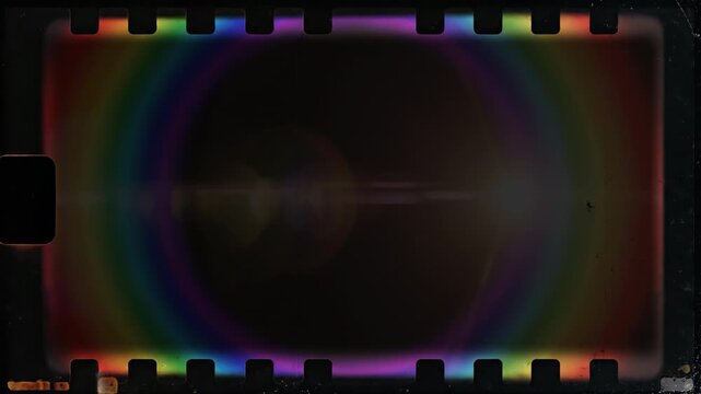 Vintage film frame with rainbow lens flare and sprocket holes. Apple ProRes 4444, transparent alpha channel overlay for professional VFX, motion graphics, and video editing.