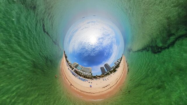 Inverted tiny planet beach drone aerial stock video 4k 2026