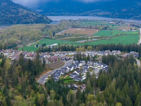 Aerial View of Suburban Neighborhood Overlooking Farmland and Fraser River at Harrison Mills, British Columbia