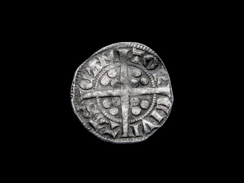 Silver long cross penny English hammered coin of King Edward II Class 11b obverse, 14th century dated around 1310- 1314 minted in Canterbury England, cut out and isolated on black background