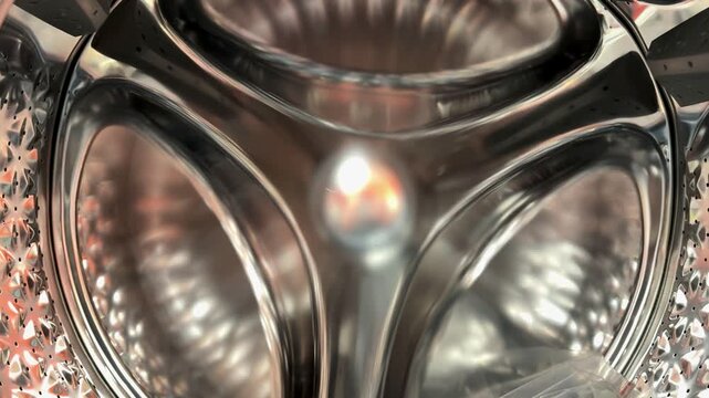 Close-up steel drum rubber seal detailing showroom display polished stainless surface with precise gasket, reflective chrome