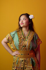 Naklejka premium Young Indonesian Asian Woman in Gold Embroidered Traditional Dress With White Flower in Hair Portrait