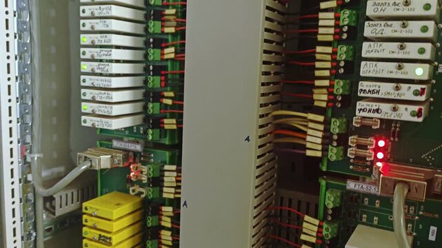 Electrical panel and relay details. Close examination of relay bank wiring setup. Comprehensive inspection of relay array components and detailed wiring configurations for electrical system