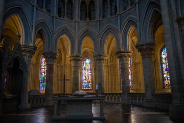 Fototapeta premium Altar and stained glass in cathedral sanctuary, Lausanne