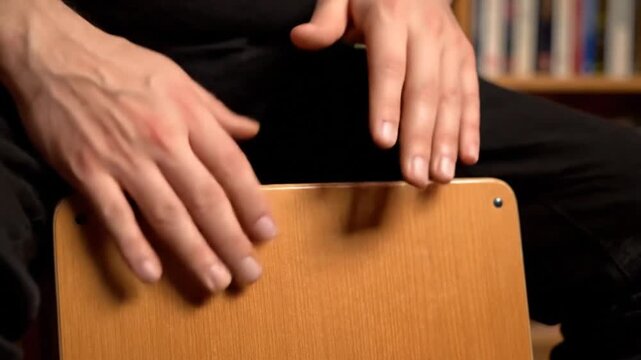 Artistic Hands Tapping Rhythmically on Wooden Surface in a Cozy Indoor Setting, Capturing the Essence of Music and Creativity