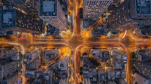 Top down view of busy city intersection with light trails