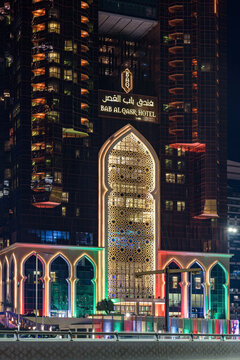 Bab Al Qasr hotel facade with Arabic mashrabiyya at night