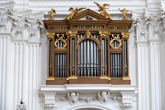 Gilded pipe organ facade in baroque church, Solothurn