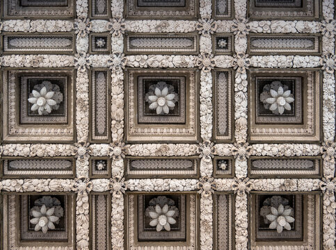 Ornate coffered ceiling with floral rosettes at Fitzwilliam Museum