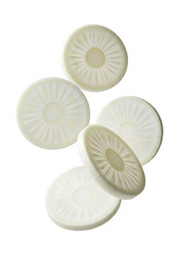 Fresh Slices of Raw White Daikon Radish Falling and Floating in the Air Isolated on White Background for Cooking and Healthy Food Design