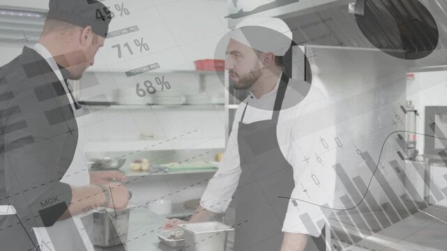 Senior chef prepping after measuring at kitchen counter, instructing line cook, charts overlaying