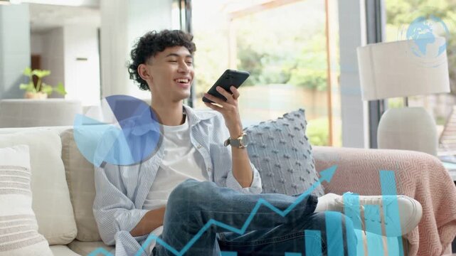Man sitting in living room speaking into phone, activating data bars lines pie while reviewing data