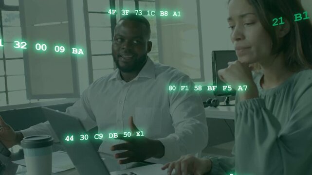 Pair typing on laptop, left man gesturing causing hex data overlay growing driving code review
