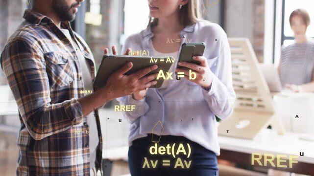 Man presenting tablet and woman tapping phone in tech office, with animated formulas appearing