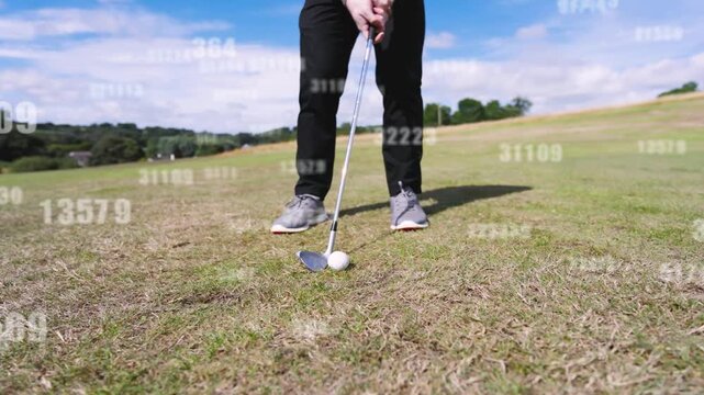 Golfer walking partner placing ball for short shot squaring hitting turf digits floating over club