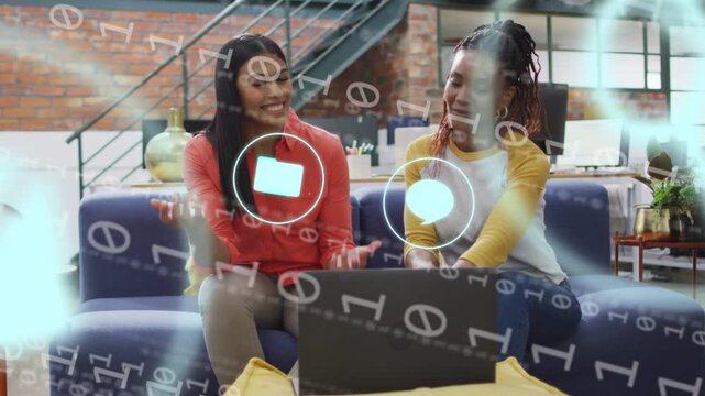 Two women typing and pointing on laptop, causing animated app icons while choosing business content