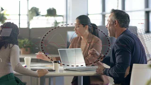 Man pointing passing charts while group on PC overlay graph growing as business team reviewing data