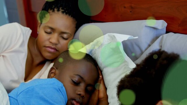 Animation starting mom holding son on bed as green circles drifting revealing daughter for wellness