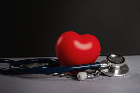 Red Heart and Stethoscope for Medical Health Concept,  world hypertension day,health insurance,world health day, doctor day,Symbolizes cardiovascular health, heart checkups.