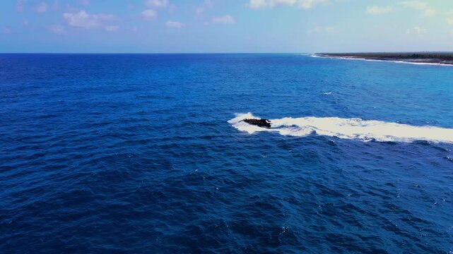 Aerial Drone View of Wave Piercing Boat Speeding Across Open Ocean - 4K