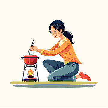 キャンプ用ストーブで料理をする日本人女性