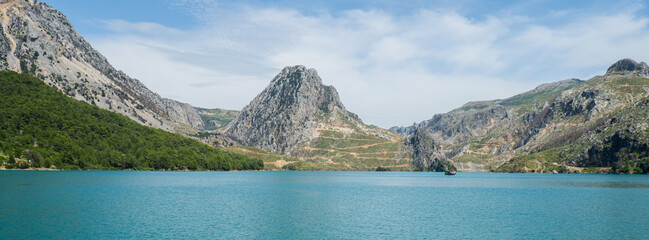 Naklejka premium Panoramic Landscape view on green canyon Antalya Turkey with turquoise water mountain cliffs and green forest. Showcasing natural beauty travel tourist destination. Vacation concept slowing down. 