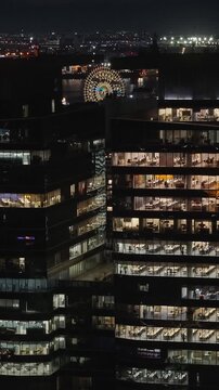 Corporate Buildings In Rio De Janeiro Brazil. Illuminated Ferris Wheel Landscape. Downtown District. Highrise Buildings. Corporate Buildings In Rio De Janeiro Brazil. Night Life Tourism. 
