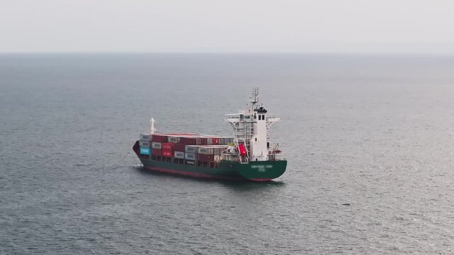 Aerial View of Container Ship Loaded with Shipping Containers &ndash; Global Cargo Transport and Maritime Trade in 4K