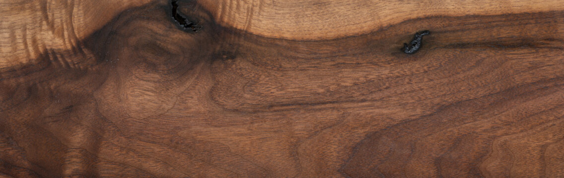 Walnut wood texture background. Wide format black walnut natural texture desktop background.	