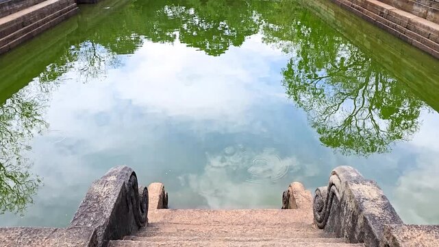 Kuttam Pokuna (Twin Ponds) in Anuradhapura, Sri Lanka. Ancient symmetrical stone bathing pools renowned for hydraulic engineering, water management systems, and Buddhist monastic heritage.