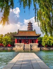 Fototapeta premium Asian temple by calm water with lush greenery and blue sky