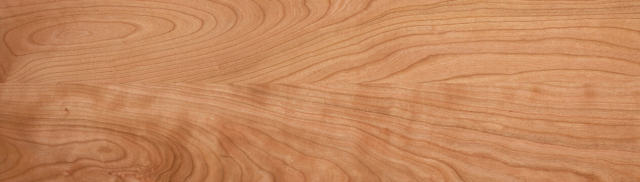 texture of wood. Solid wood tabletop background. Cherry wood plank texture. Cherry wood solid wood long tabletop. 