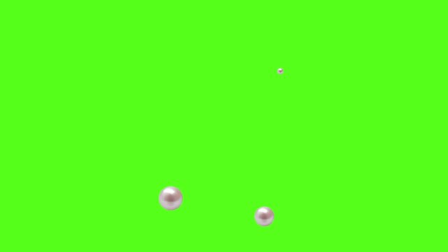 A video showcasing small white objects falling on a bright green background