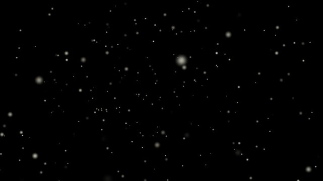 An abstract motion of falling snowflakes and glowing dust particles drifting through a dark winter night sky across a black cosmic galaxy star field