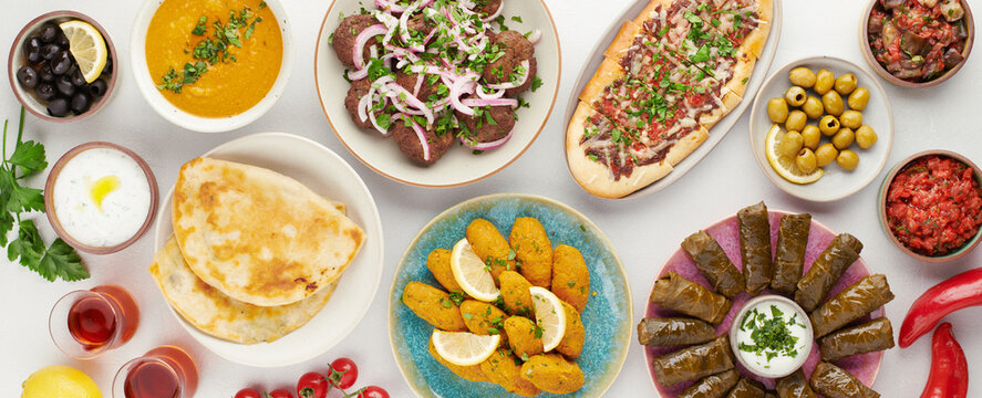 Middle eastern turkish meze table with lentil kofte pide dolma and dips top view