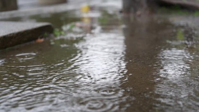 water flowing into a puddle